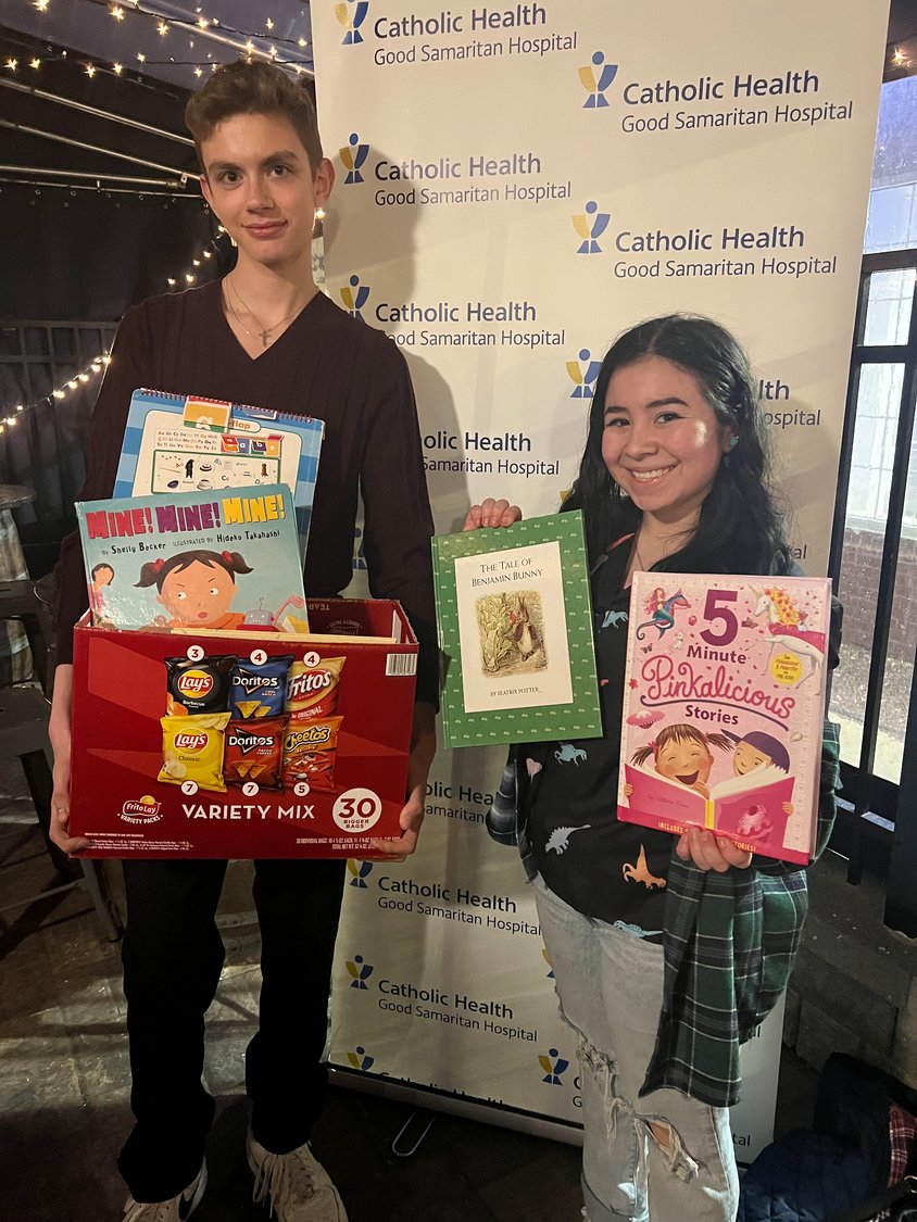 East Islip High School students and members of the Key Club, Sarah Vasquez, Key Club president, and Ian Schneider, donated children’s books for the new Good Samaritan Mother Baby Unit.